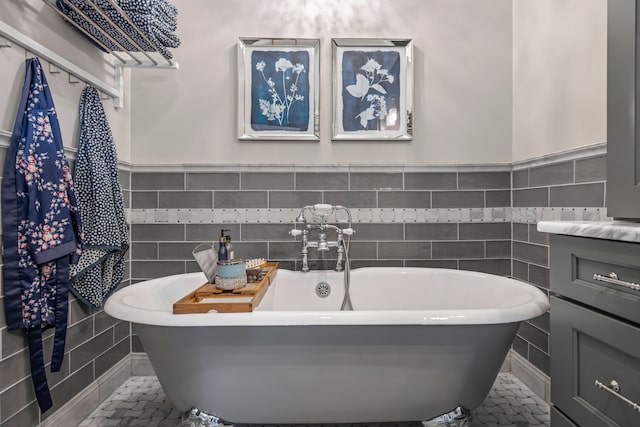 33 Sylvan Ave, Pleasant Ridge, MI 48069 - full bathroom with a soaking tub, tile walls, and wainscoting