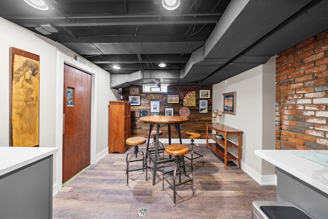 33 Sylvan Ave, Pleasant Ridge, MI 48069 - bar featuring indoor bar, wood finished floors, and baseboards