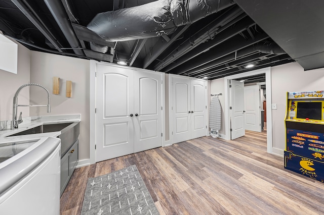 33 Sylvan Ave, Pleasant Ridge, MI 48069 - finished basement with baseboards, light wood finished floors, and a sink