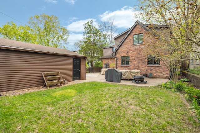 33 Sylvan Ave, Pleasant Ridge, MI 48069 - rear view of property with a patio, an outdoor fire pit, fence, a yard, and brick siding