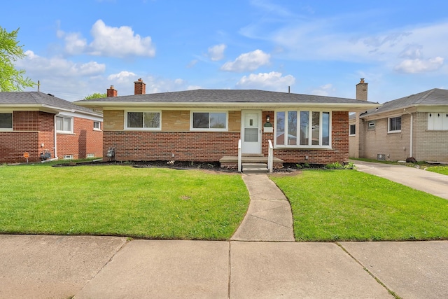 view of front of house featuring a chimney, entry steps, brick siding, and a front lawn