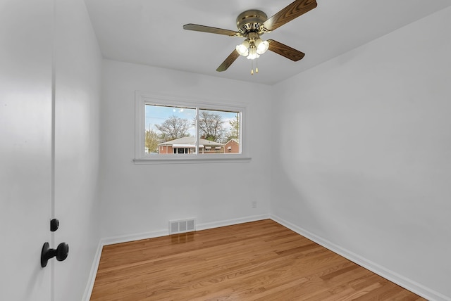unfurnished room with baseboards, ceiling fan, light wood-type flooring, and visible vents