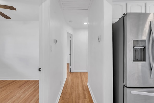 corridor with baseboards, recessed lighting, attic access, and light wood-type flooring
