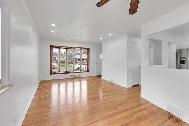 unfurnished living room with ceiling fan, recessed lighting, light wood finished floors, and visible vents