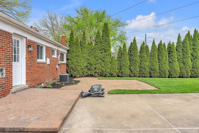 view of yard with a patio area and cooling unit