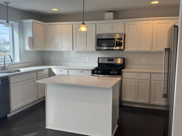 kitchen with a sink, stainless steel appliances, recessed lighting, and white cabinets