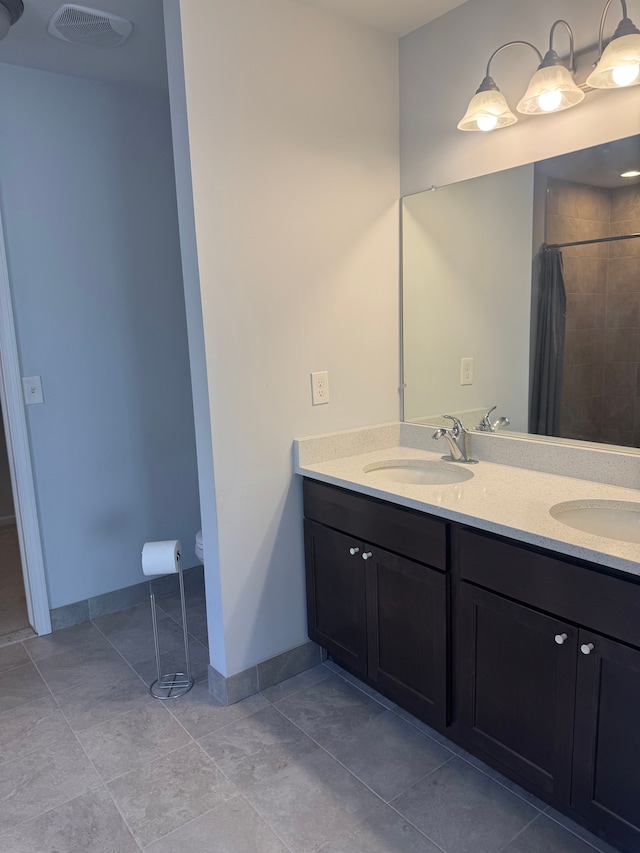 full bathroom with a shower with shower curtain, visible vents, a sink, and double vanity