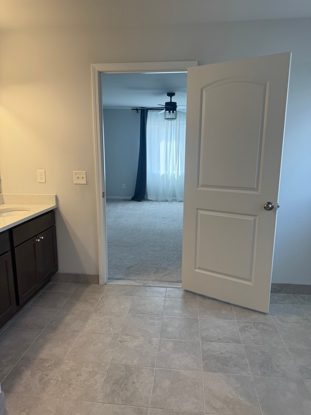 bathroom featuring baseboards and vanity
