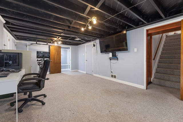 carpeted home office featuring baseboards