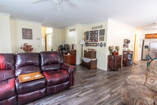 living area featuring ceiling fan, ornamental molding, visible vents, and dark wood-type flooring
