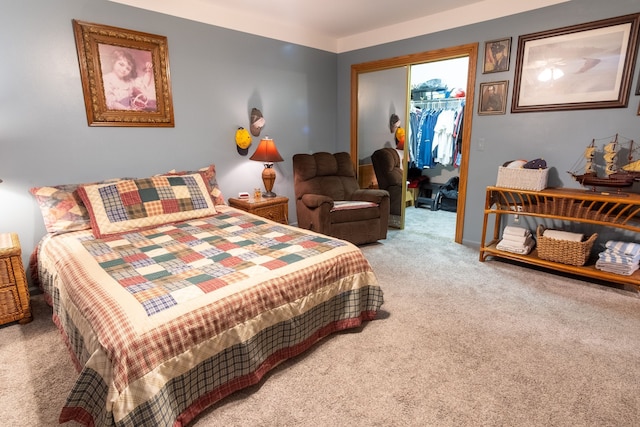 bedroom featuring a closet, a spacious closet, and carpet floors