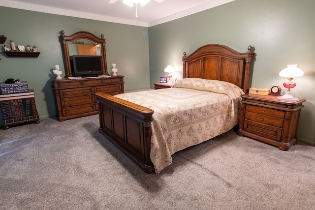 bedroom featuring crown molding, ceiling fan, and light colored carpet