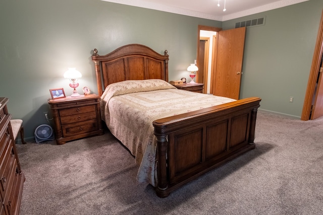 carpeted bedroom with visible vents and baseboards