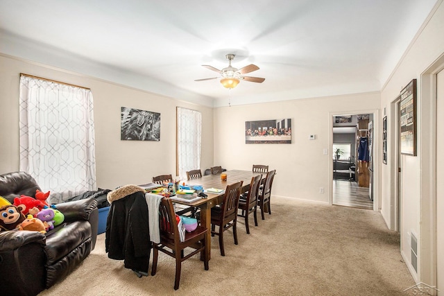 4895 Sycamore Rd, Newport, MI 48166 - dining space with healthy amount of natural light, ceiling fan, and light carpet