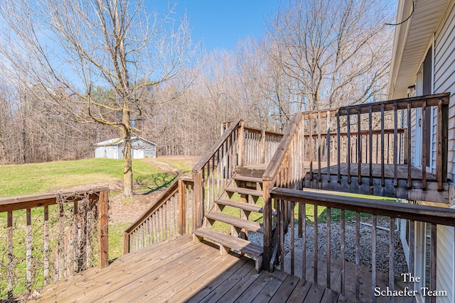 wooden deck with stairs and a lawn