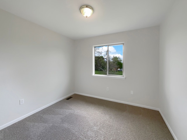 1555 S Harris Rd, Ypsilanti, MI 48198 - carpeted empty room featuring baseboards and visible vents