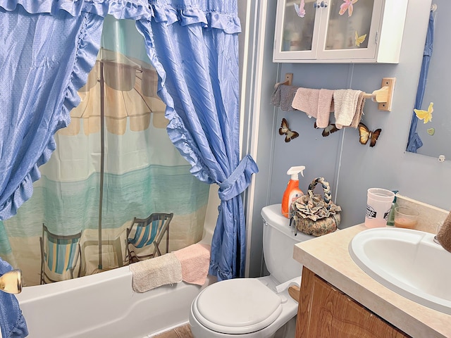 full bathroom featuring toilet, vanity, and shower / bath combo with shower curtain