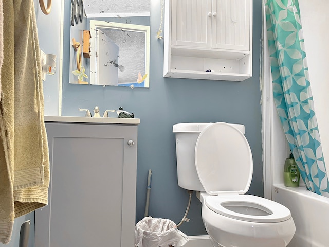 full bathroom featuring toilet, vanity, and shower / tub combo with curtain