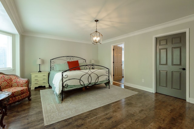 bedroom featuring a chandelier, crown molding, baseboards, and dark wood finished floors
