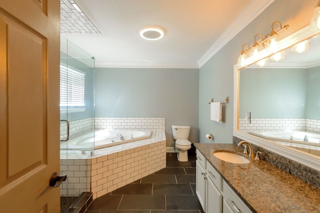 bathroom featuring tile patterned floors, a garden tub, vanity, ornamental molding, and toilet