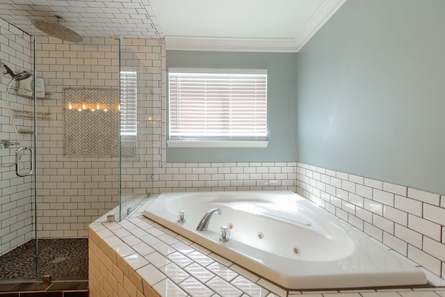bathroom with a stall shower, a tub with jets, crown molding, and tile walls
