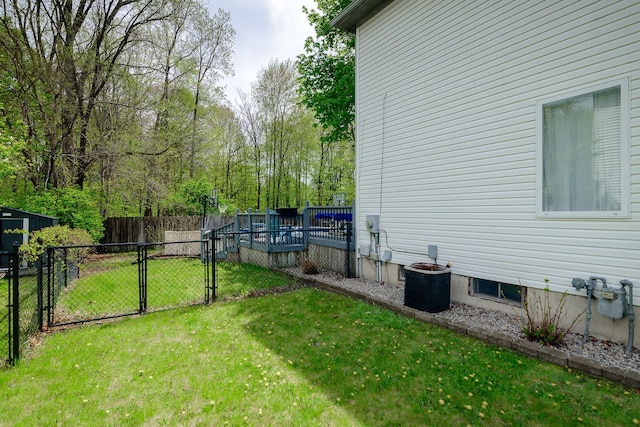 view of yard featuring a gate and cooling unit