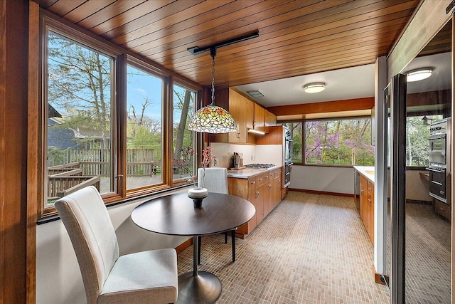 sunroom with visible vents and a healthy amount of sunlight