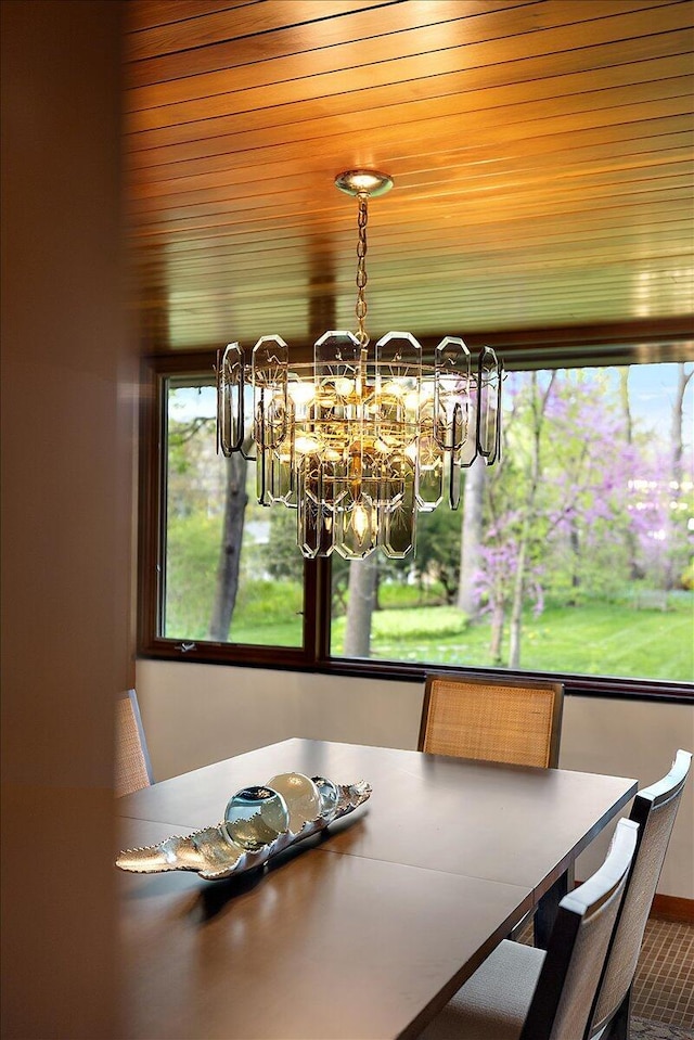 dining area with an inviting chandelier