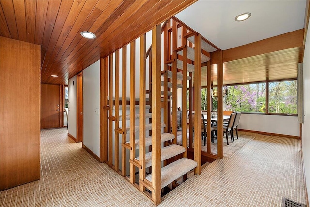 interior space featuring brick floor, visible vents, baseboards, and recessed lighting