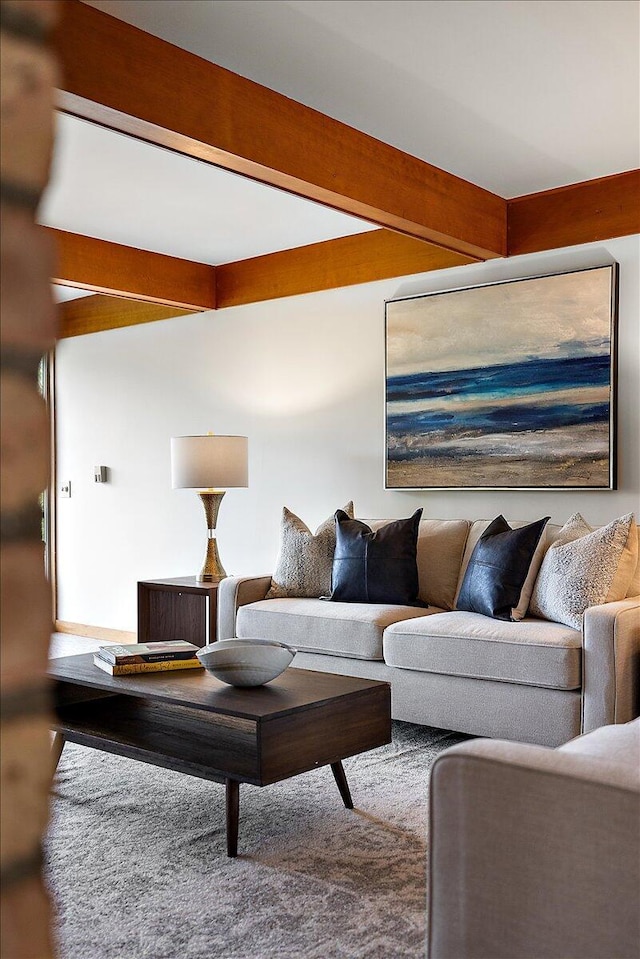 living area with beam ceiling