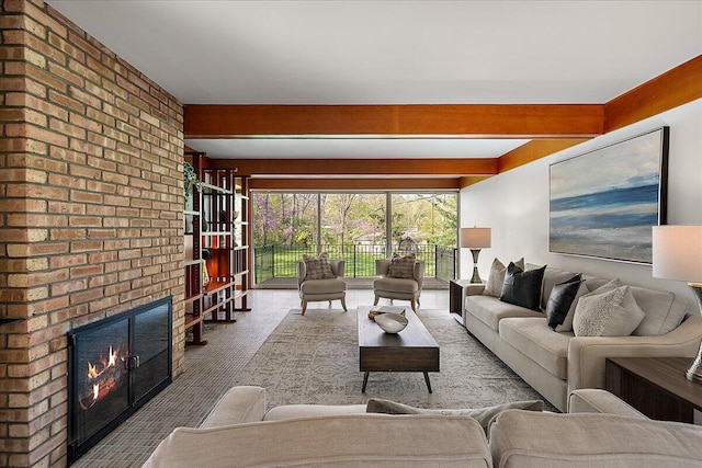 carpeted living room with a brick fireplace and brick wall