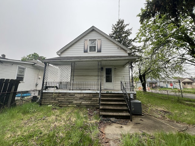 75 Abbott St, River Rouge, MI 48218 - view of front of property featuring covered porch, fence, and cooling unit