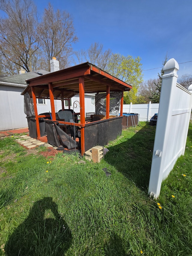 view of outbuilding featuring fence
