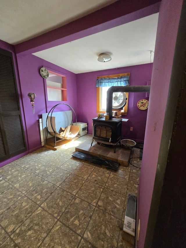 bedroom featuring a wood stove