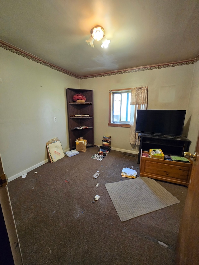 carpeted living area with baseboards