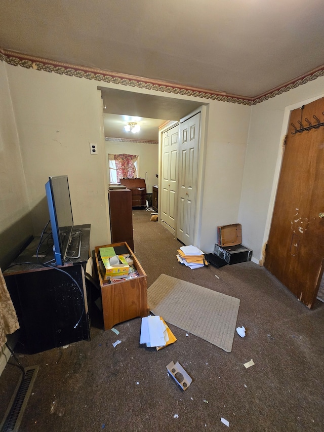 interior space with a closet and carpet floors