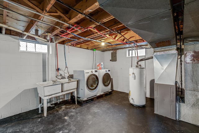 below grade area featuring separate washer and dryer, electric panel, plenty of natural light, and gas water heater