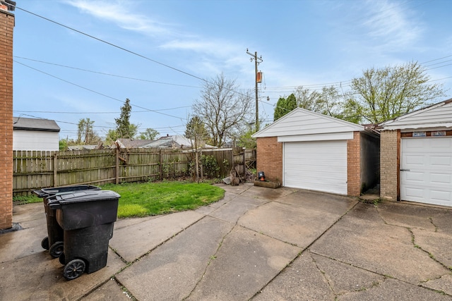 exterior space with an outbuilding and fence