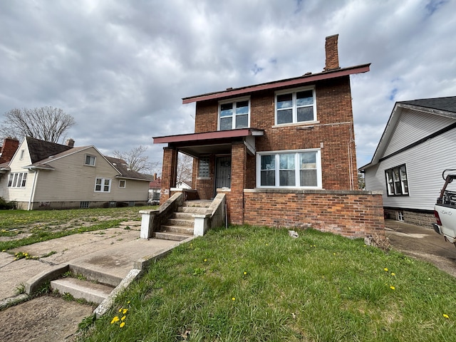 view of front of house with brick siding and a chimney