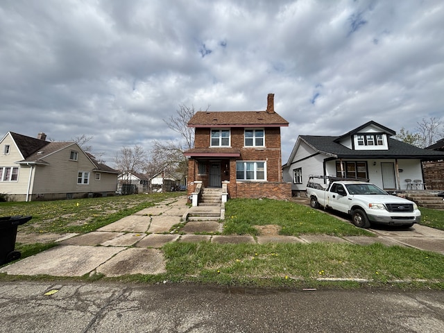 view of front of home with a chimney, brick siding, a residential view, and concrete driveway