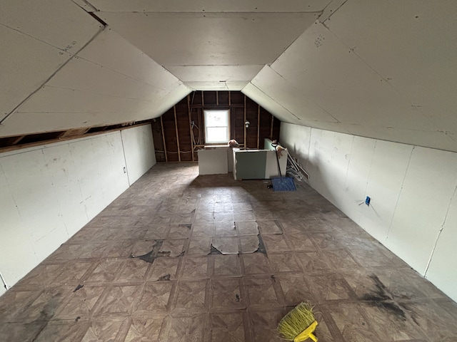 additional living space featuring vaulted ceiling