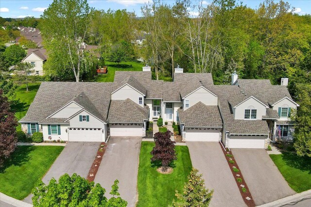 863 Calpernia, Wixom, MI 48393 - traditional-style house featuring asphalt driveway and a front yard