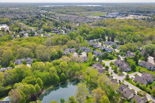 863 Calpernia, Wixom, MI 48393 - aerial view of residential area featuring a nearby body of water and a heavily wooded area