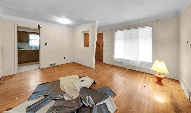 23022 Lexington Ave, Eastpointe, MI 48021 - unfurnished living room featuring visible vents and wood finished floors