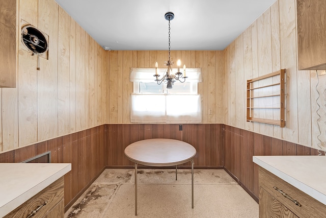 23022 Lexington Ave, Eastpointe, MI 48021 - dining room with wainscoting, an inviting chandelier, and wooden walls