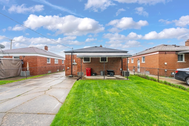 23022 Lexington Ave, Eastpointe, MI 48021 - back of property with fence, brick siding, driveway, a yard, and cooling unit