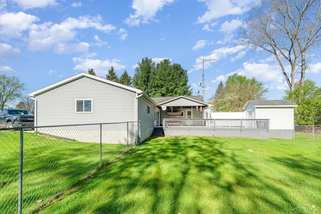 view of yard with an outbuilding, a storage shed, and a wooden deck