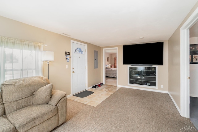 living room with carpet and baseboards