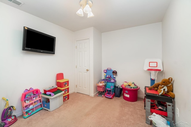 playroom featuring carpet and baseboards