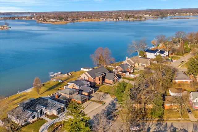 birds eye view of property featuring a water view and a residential view